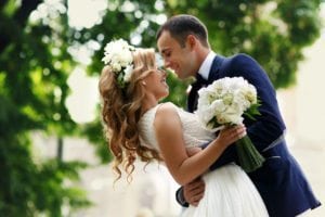 A bride and groom pose for a picture at The Inn at 97 Winder a Detroit weddings venue